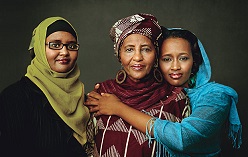  Abdi stands with her two daughters (http://www.dhaf.org/about-us/ ())